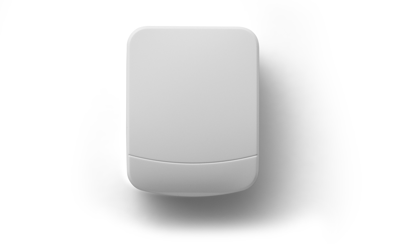 White garage door sensor against a white backdrop.